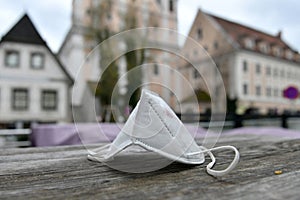 Corona crisis - lockdown - FFP2 mask lies on a table in a street in Steyr, Austria, Europe photo